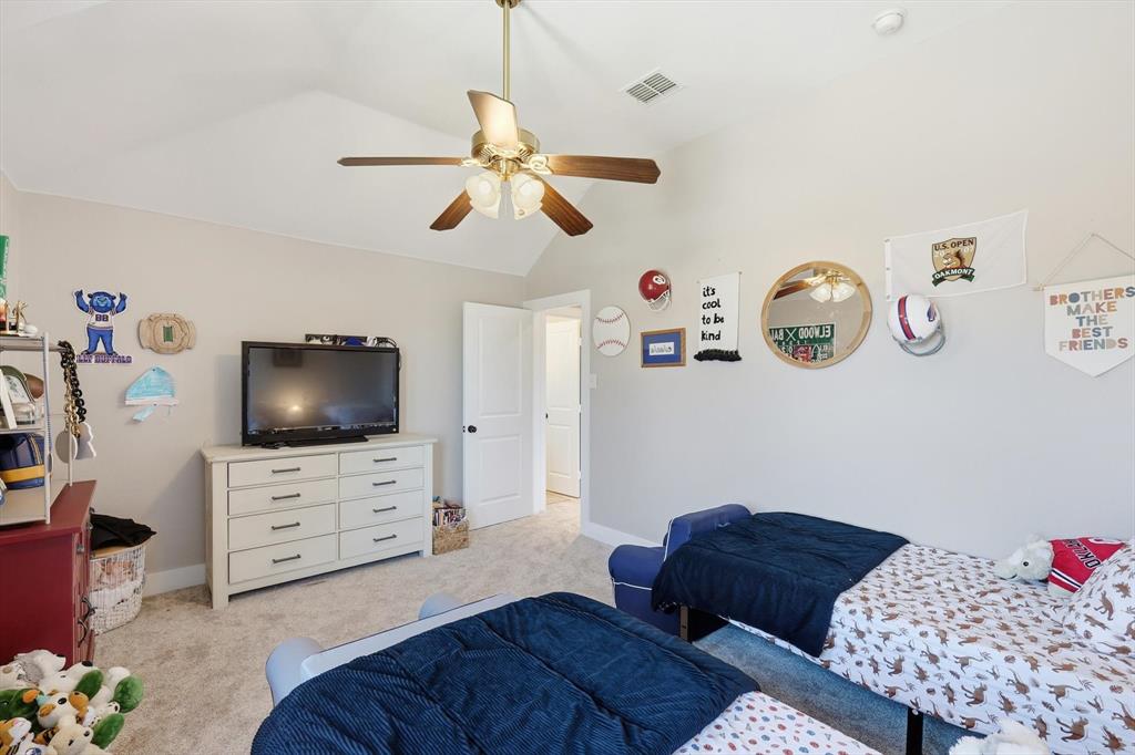 3618 Applewood Road Melissa, TX 75454 - Photo 26 of 39 a living room with furniture and a flat screen tv