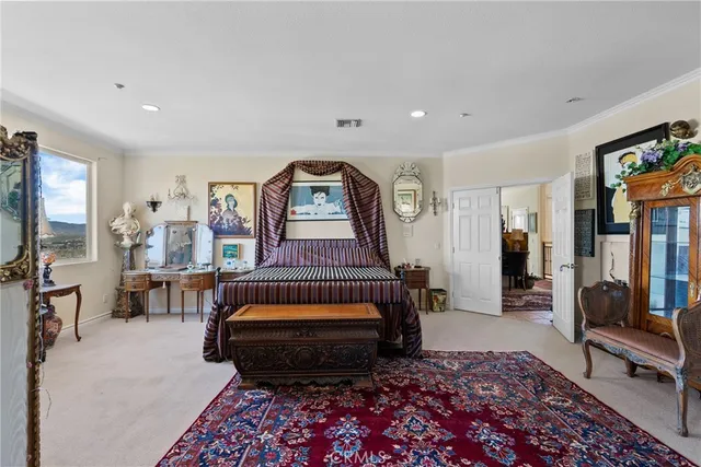 a bedroom with furniture and a window