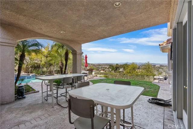 a view of a tables and chairs in patio
