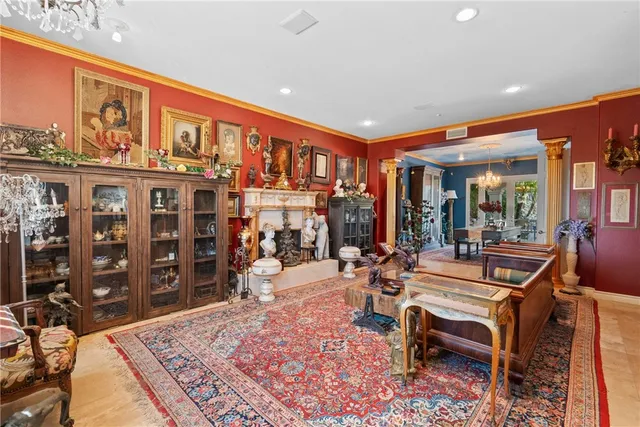 a living room with furniture a table and chairs