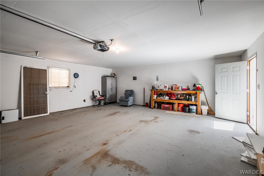 3302 West Carmichael Road Golden Valley, AZ 86413 - Photo 54 of 54 a view of a livingroom with toys and a ceiling fan