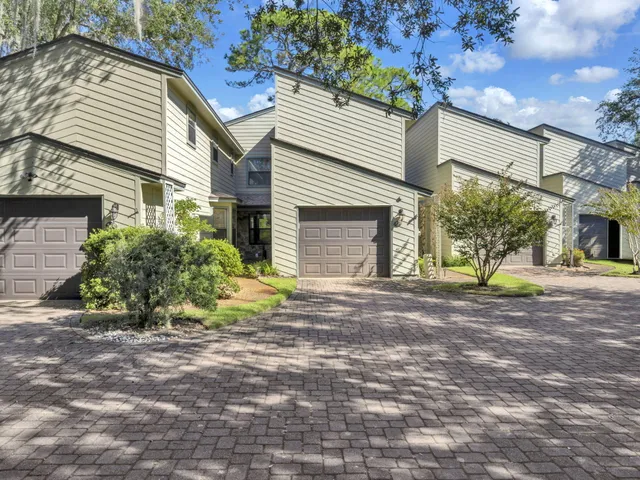 a view of a house with a yard and garage