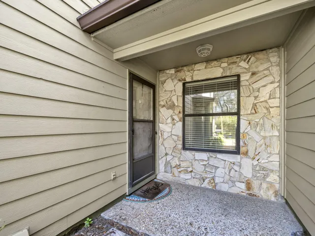 a view of a room with a chandelier