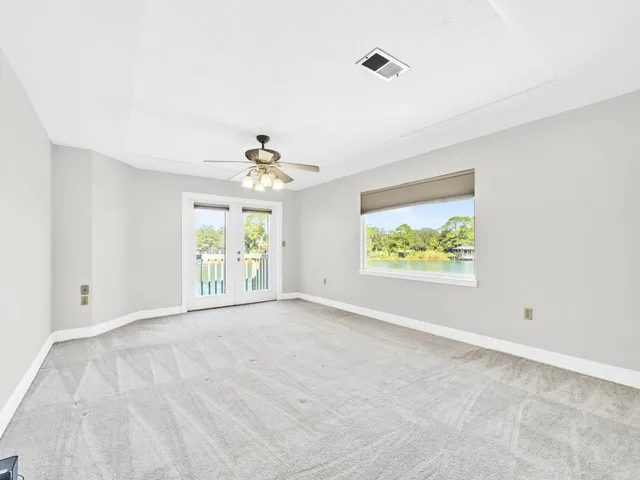 a spacious bathroom with a granite countertop tub sink and mirror
