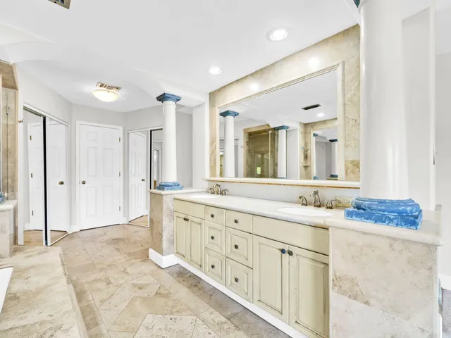 a view of a lake with houses in the back