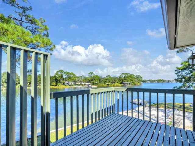 a view of balcony with wooden floor