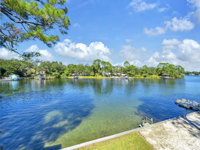 a view of a lake with a yard