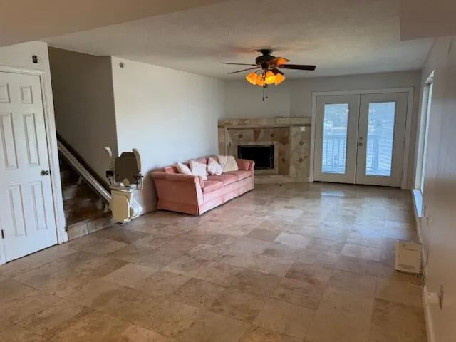 a living room with furniture and a fireplace