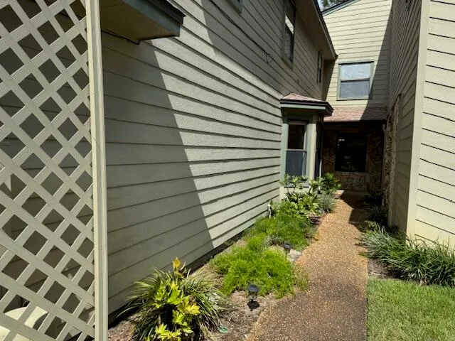 a view of a house with a backyard