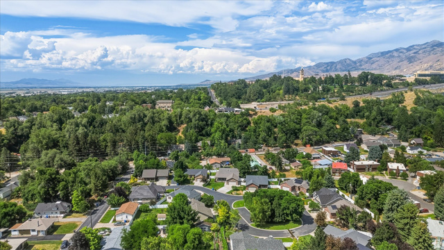 689 Apple Drive Logan, UT 84321 - Photo 46 of 52 Aerial perspective showcasing a residential area with varied home styles and mature trees