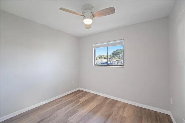 a bathroom with a sink a toilet and a large mirror