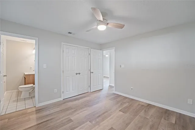 a bathroom with a toilet a sink and a shower