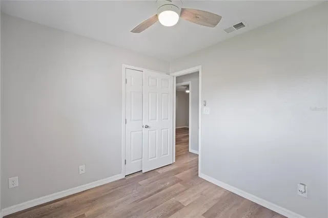 an aerial view of a house with a yard and garden