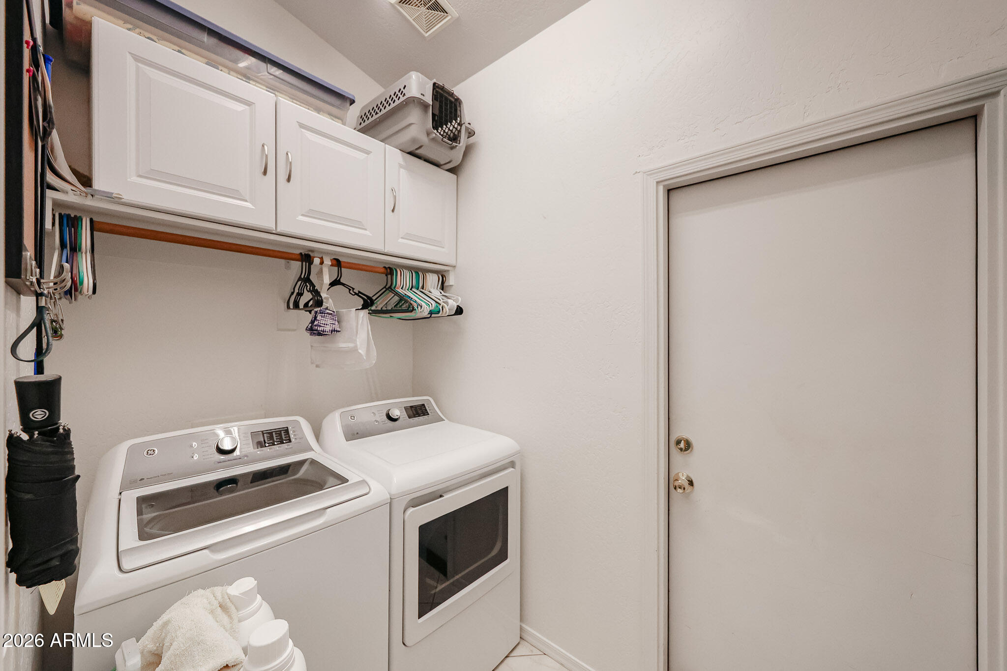 14980 South Capistrano Road Arizona City, AZ 85123 - Photo 13 of 39 a view of storage and utility room with washer and dryer