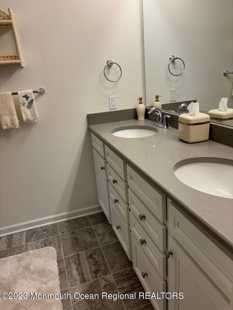 12 Harvest Ridge Road Howell, NJ 07731 - Photo 13 of 27 a bathroom with double vanity sink and a mirror