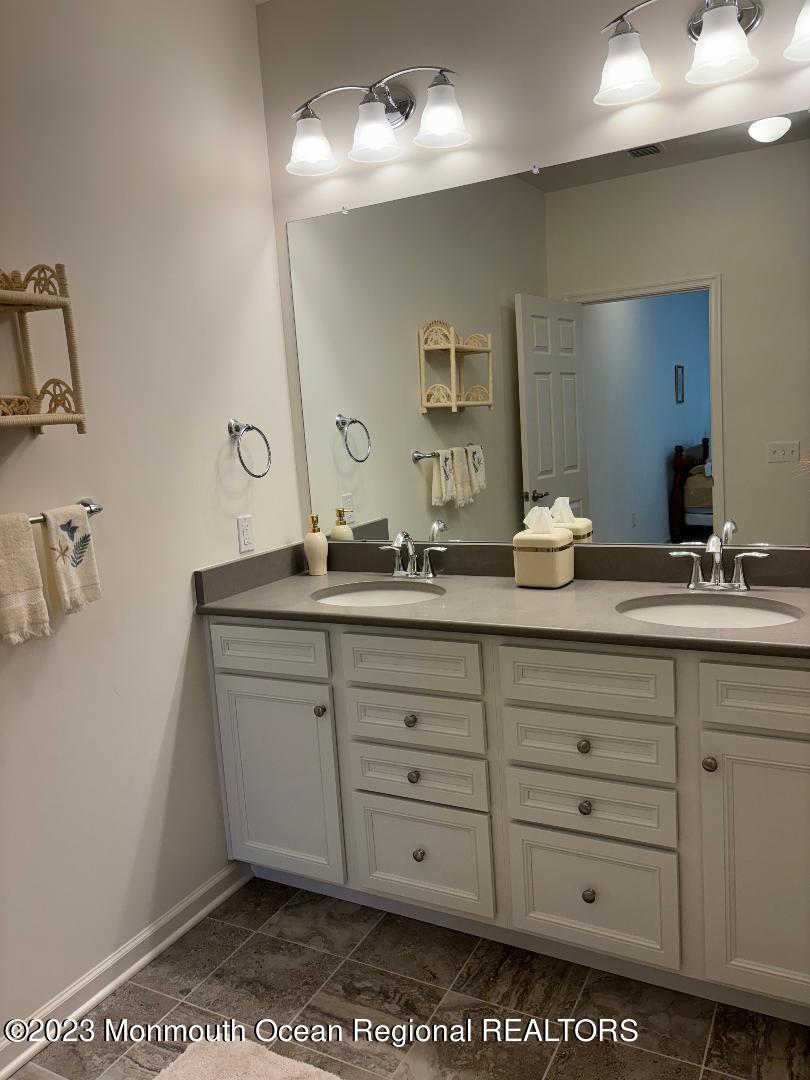 12 Harvest Ridge Road Howell, NJ 07731 - Photo 14 of 27 a bathroom with a sink double vanity and a mirror