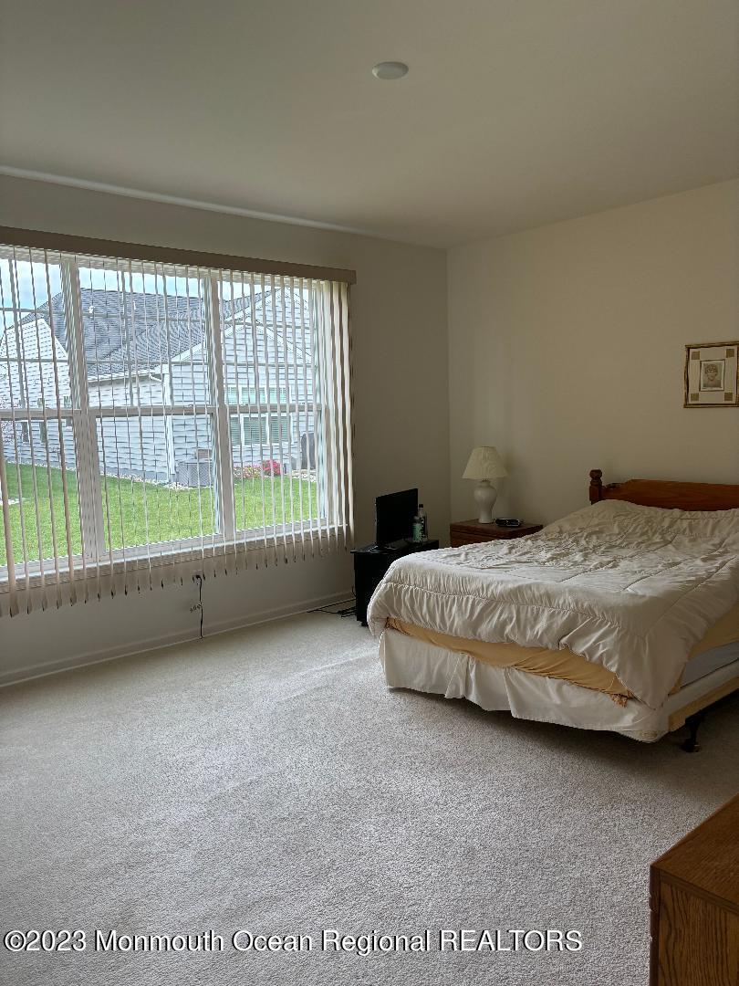 12 Harvest Ridge Road Howell, NJ 07731 - Photo 15 of 27 a bedroom with a bed and a large window