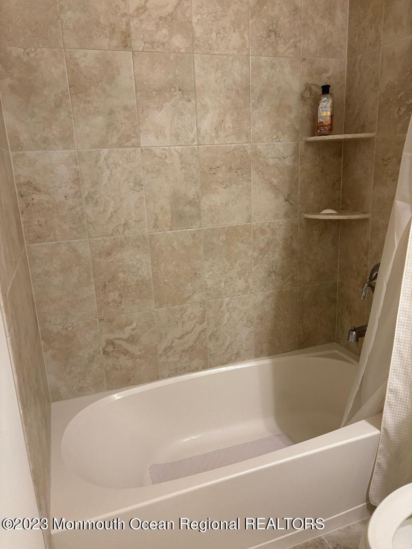 12 Harvest Ridge Road Howell, NJ 07731 - Photo 21 of 27 a bath tub sitting next to a white toilet