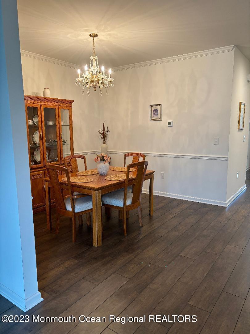 12 Harvest Ridge Road Howell, NJ 07731 - Photo 22 of 27 a view of a dining room with furniture and chandelier