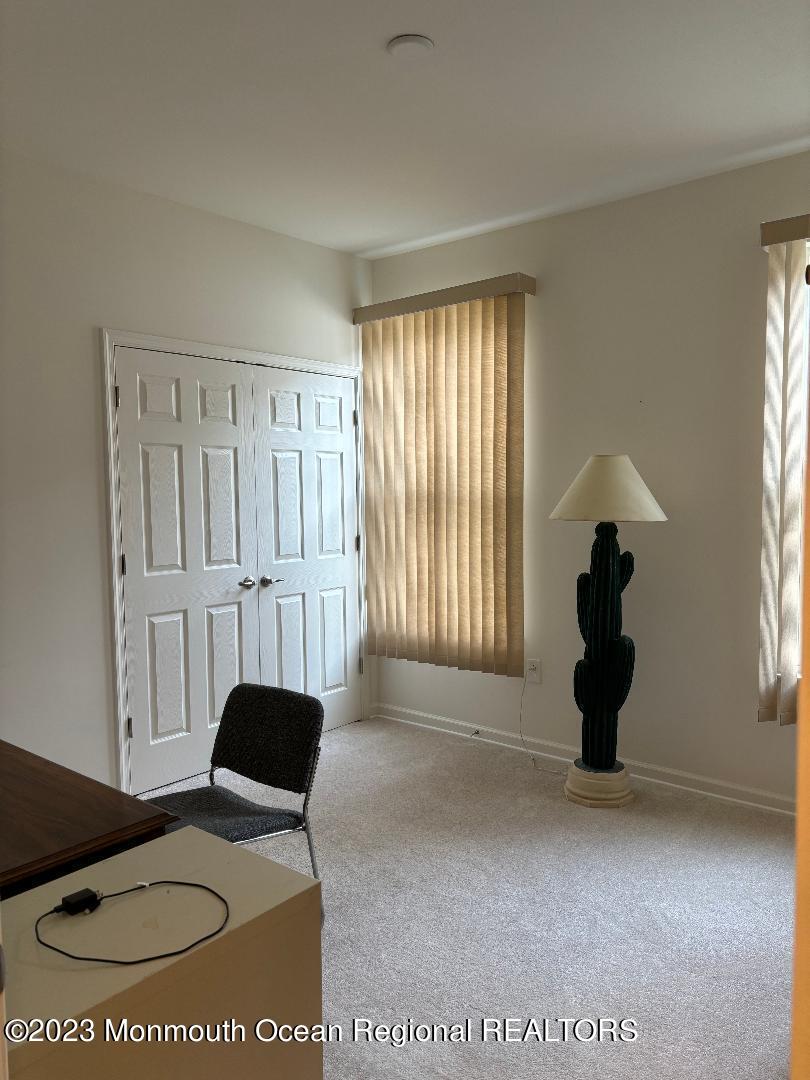 12 Harvest Ridge Road Howell, NJ 07731 - Photo 25 of 27 a living room with furniture and a window