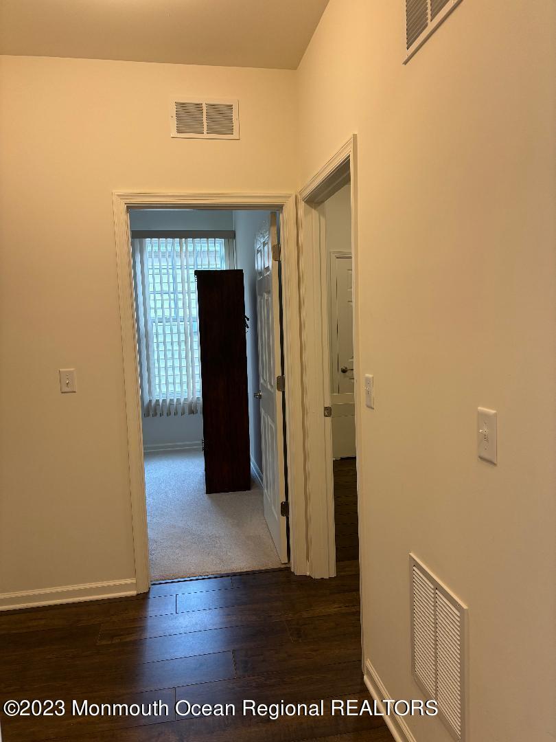 12 Harvest Ridge Road Howell, NJ 07731 - Photo 27 of 27 a view of a hallway with wooden floor and staircase