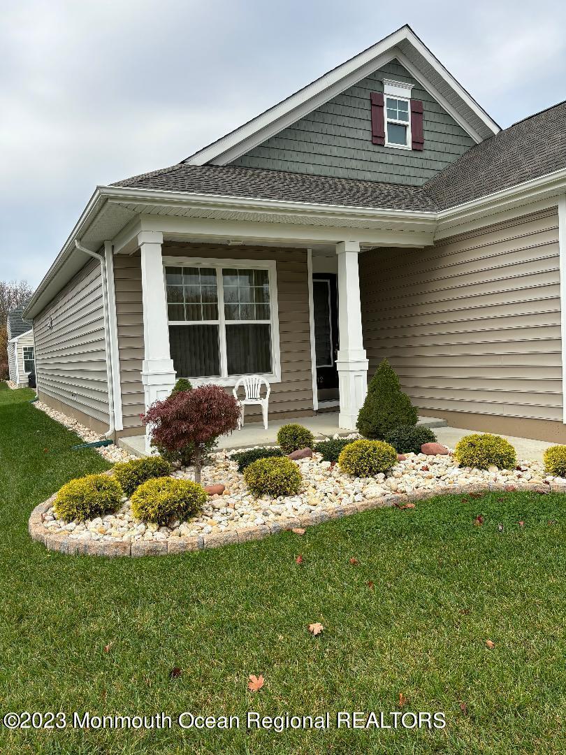12 Harvest Ridge Road Howell, NJ 07731 - Photo 4 of 27 a front view of a house with a yard