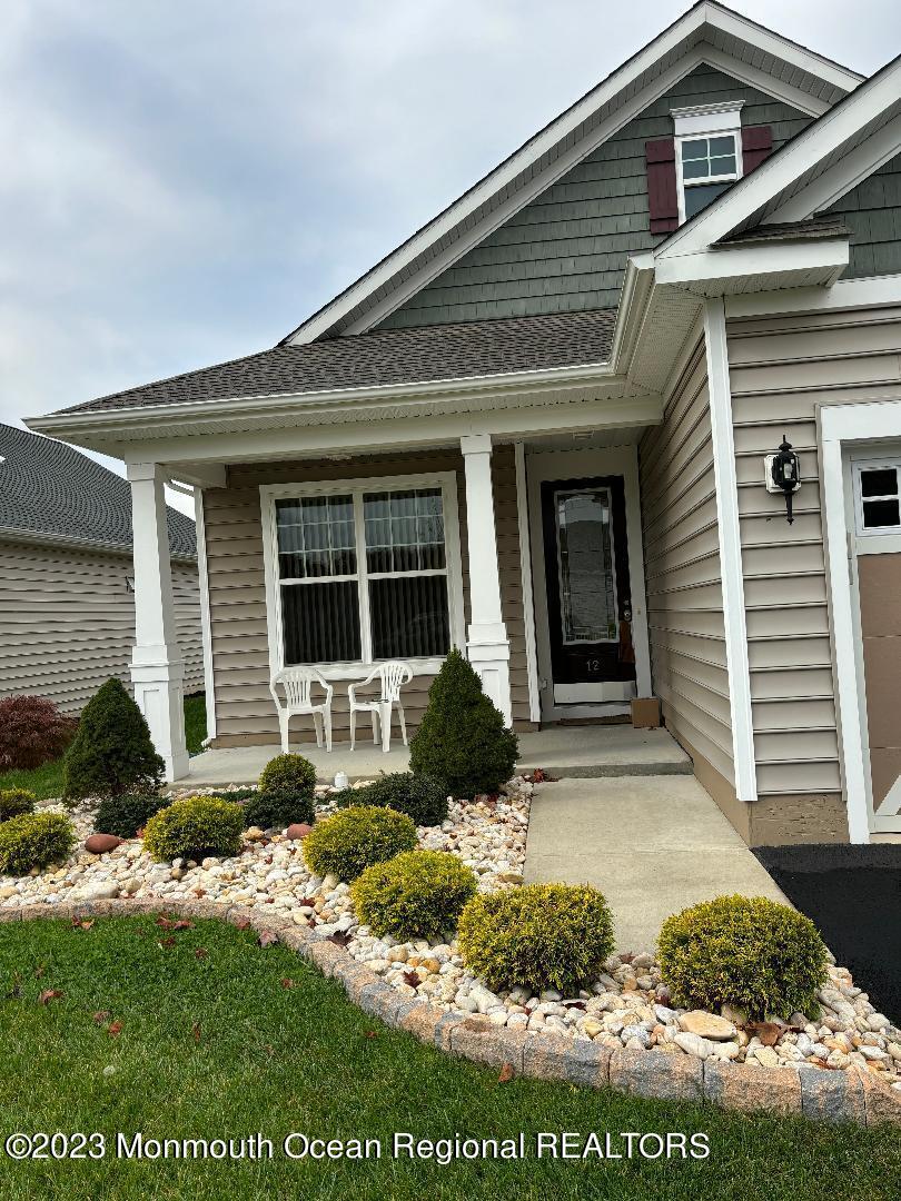 12 Harvest Ridge Road Howell, NJ 07731 - Photo 5 of 27 a front view of a house with a yard