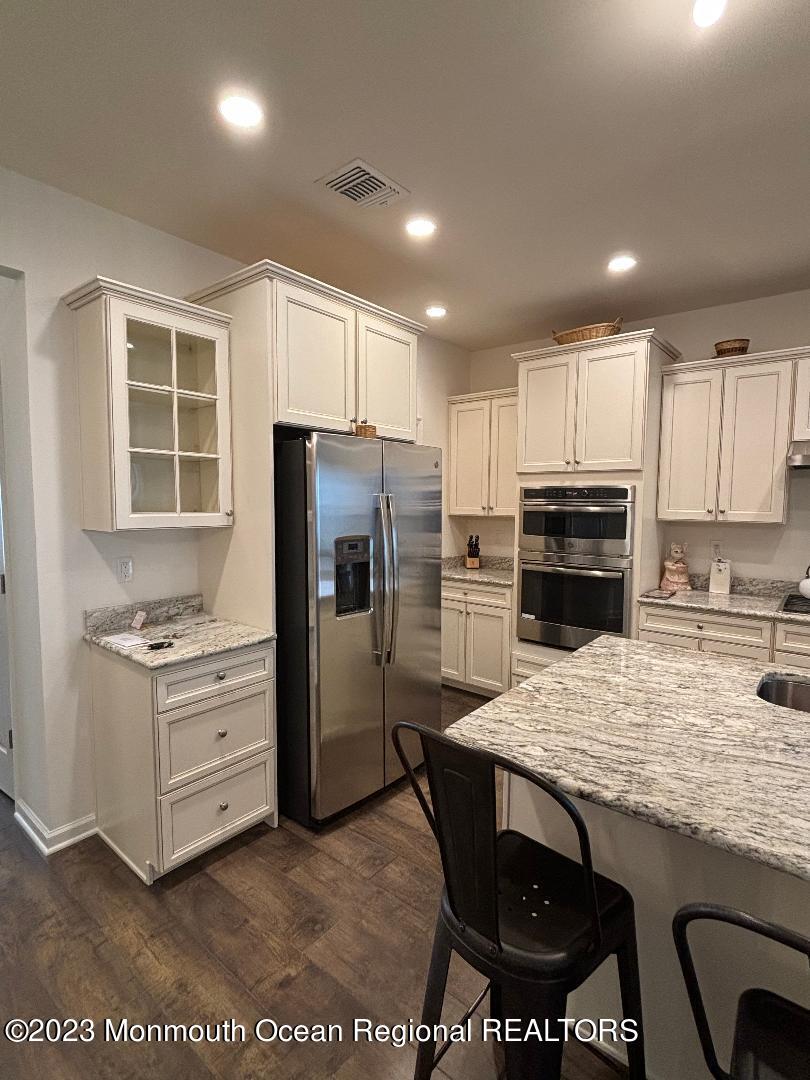 12 Harvest Ridge Road Howell, NJ 07731 - Photo 8 of 27 a kitchen with a stove a refrigerator and a sink