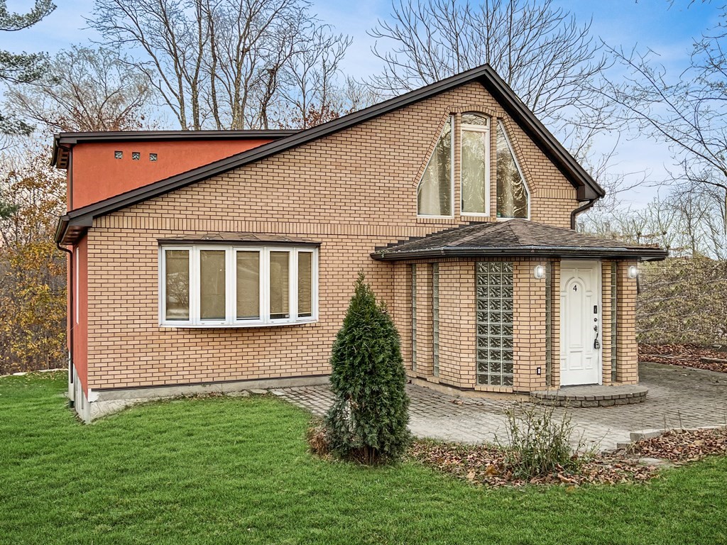 4 Carl Street Worcester, MA 01607 - Photo 1 of 27 a front view of a house with a yard