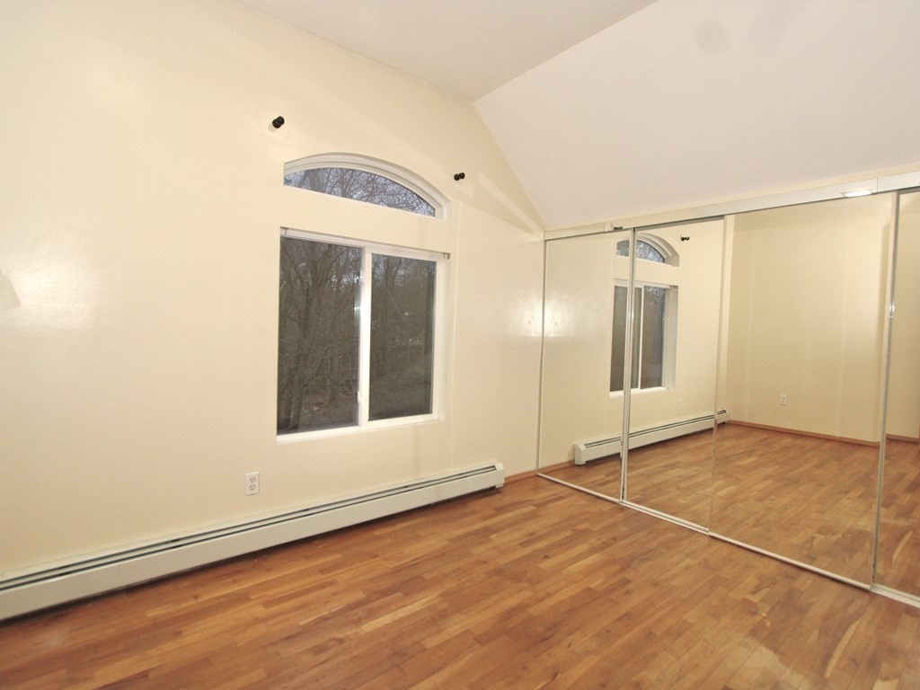 4 Carl Street Worcester, MA 01607 - Photo 16 of 27 a view of an empty room with cabinet and a window