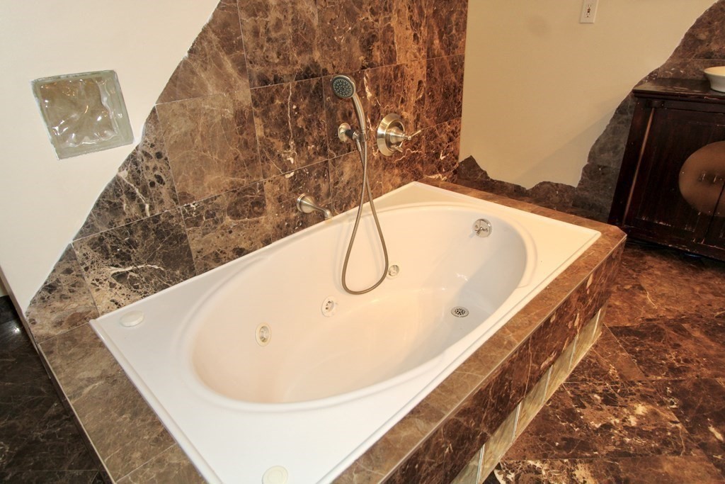 4 Carl Street Worcester, MA 01607 - Photo 19 of 27 a bathroom with a bathtub