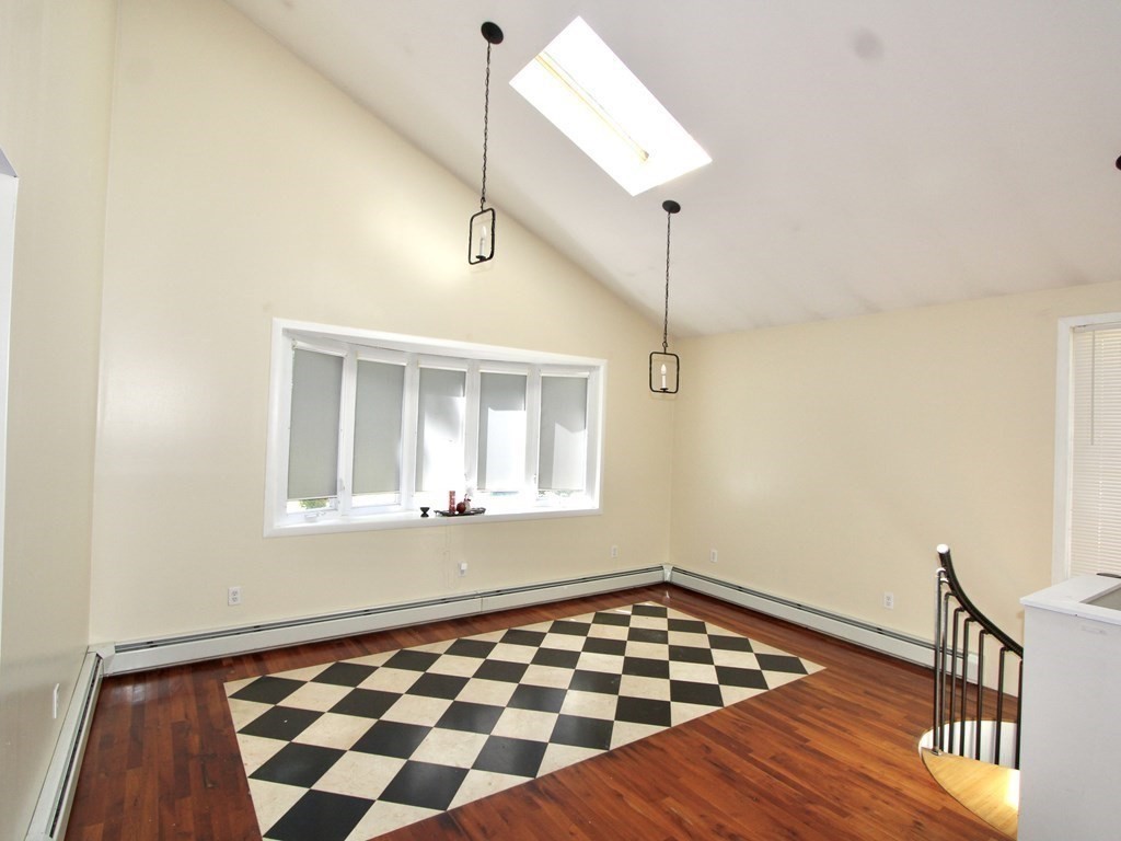 4 Carl Street Worcester, MA 01607 - Photo 5 of 27 a view of a room with wooden floor and window