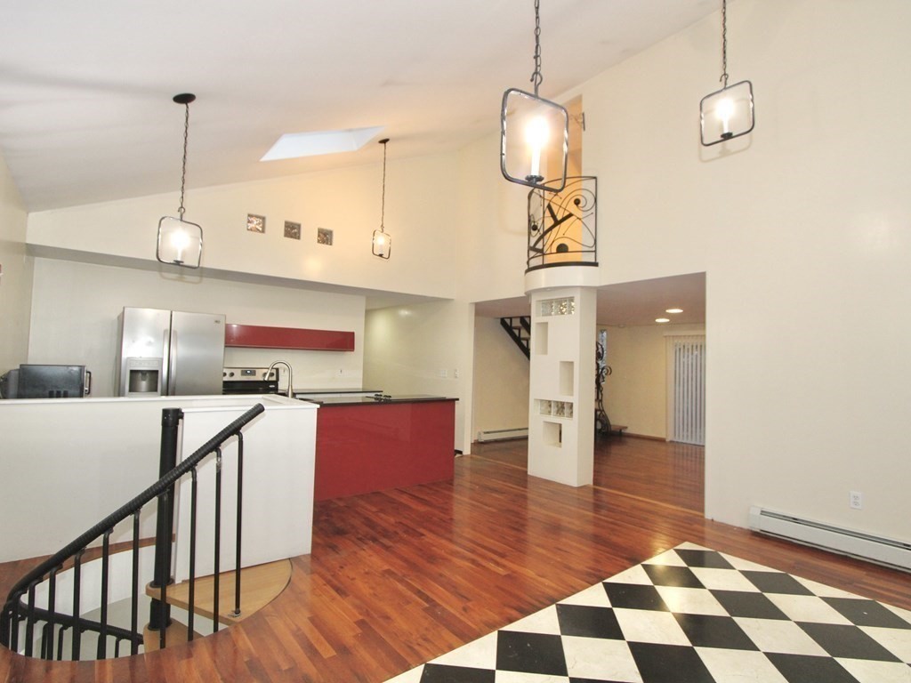 4 Carl Street Worcester, MA 01607 - Photo 7 of 27 a kitchen with stainless steel appliances granite countertop a stove a sink and a wooden floors