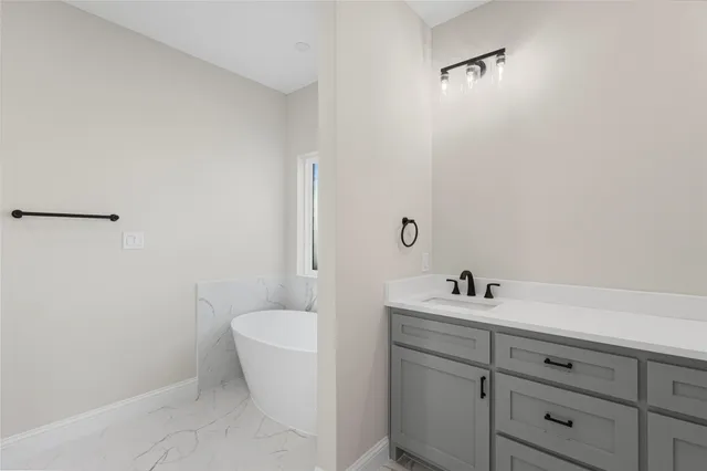 a bathroom with a sink and a toilet