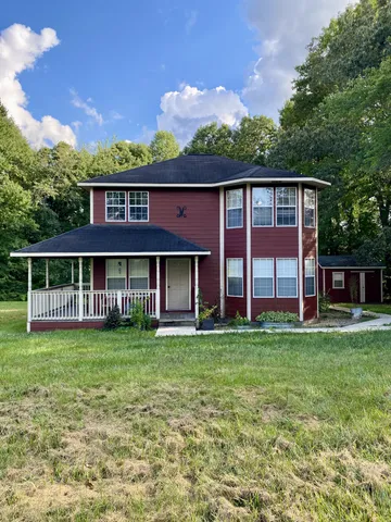 a view of a house with a garden