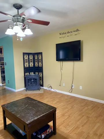 a room with pool table and flat screen tv