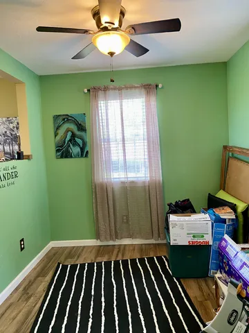 a bedroom with bunk bed and a window