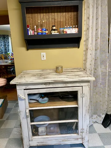 a stove top oven sitting inside of a kitchen