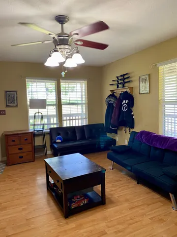 a living room with furniture and a window