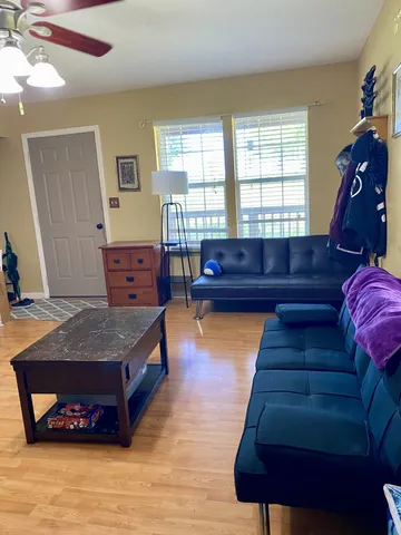 a living room with furniture and a window