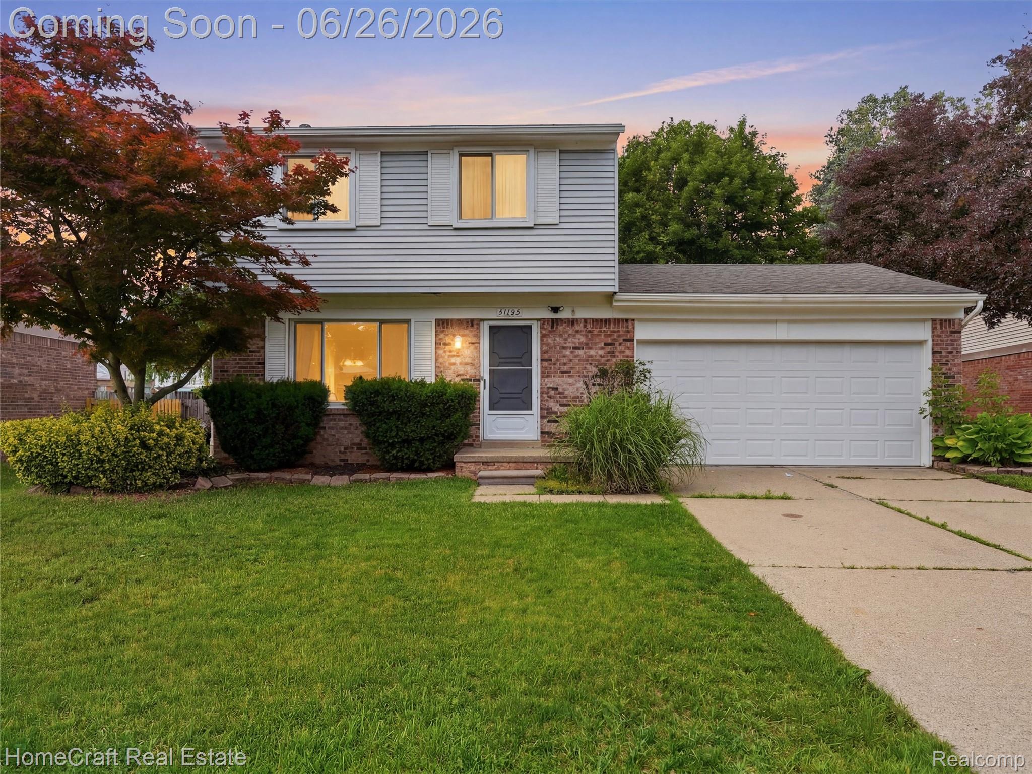 41462 Simcoe Drive Canton, MI 48188 - Photo 1 of 10 Two-story residence featuring light gray siding and brick accents