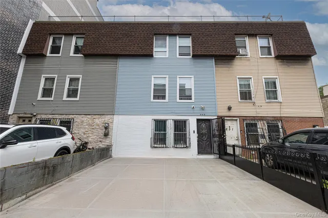 a front view of a house with parking space