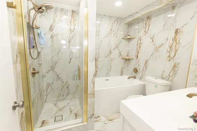 a bathroom with a bathtub and shower