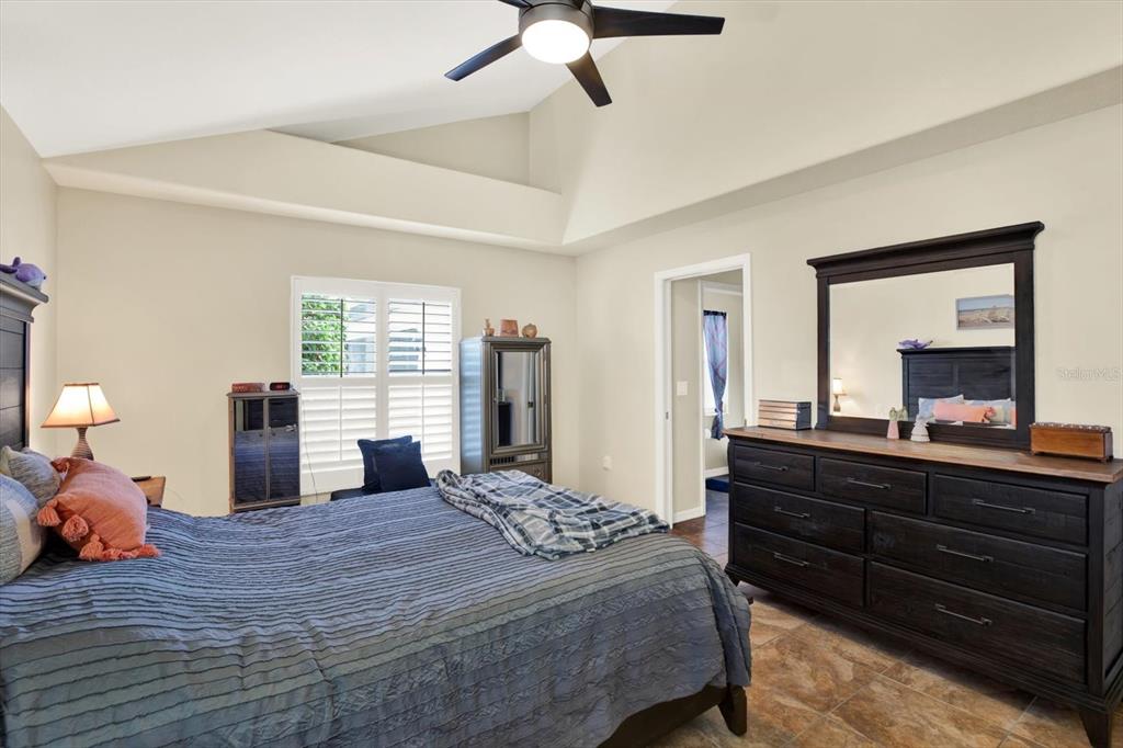 2021 Meadow Rue Court Trinity, FL 34655 - Photo 14 of 41 a bedroom with a bed and a large mirror on the dresser
