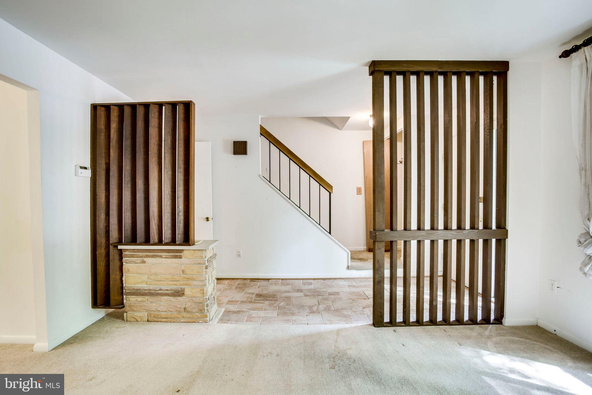 11904 Barrel Cooper Court Reston, VA 20191 - Photo 8 of 47 Living room and foyer with stone planter