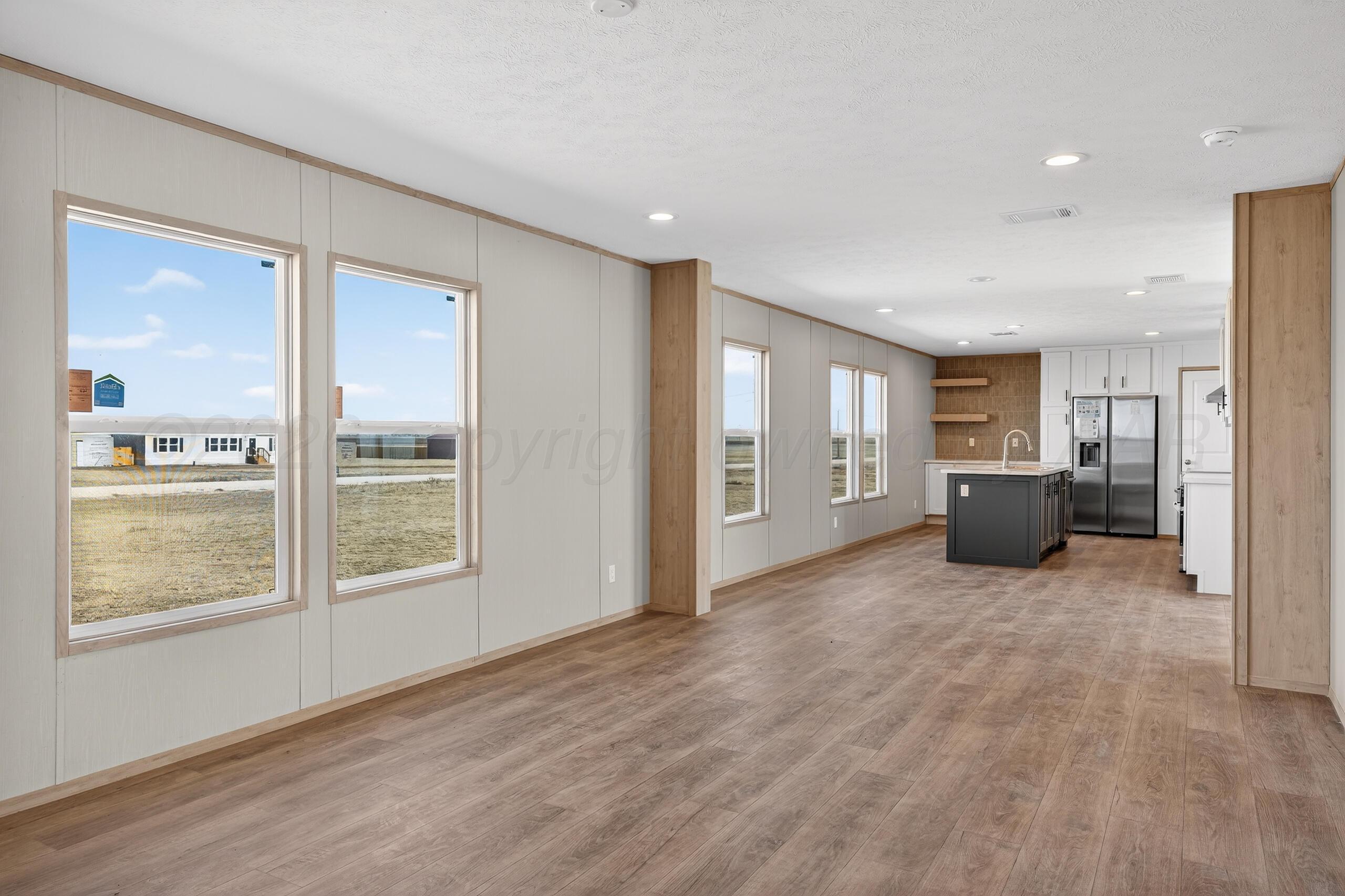 2680 Avery Rd Canyon Canyon, TX 79015 - Photo 11 of 35 an empty room with kitchen and windows