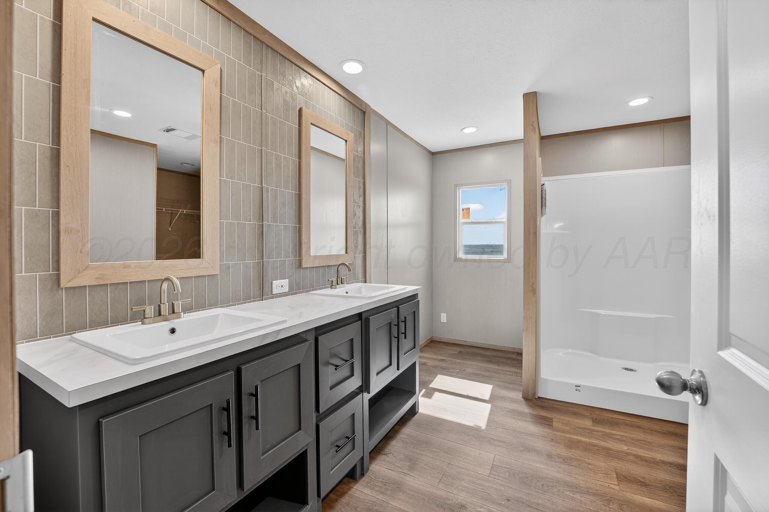 2680 Avery Rd Canyon Canyon, TX 79015 - Photo 14 of 37 a spacious bathroom with a double vanity sink mirror and double