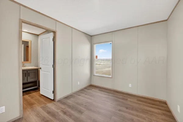 an empty room with a wooden door