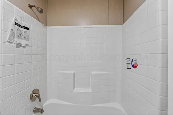 a view of an empty room with wooden floor and closet