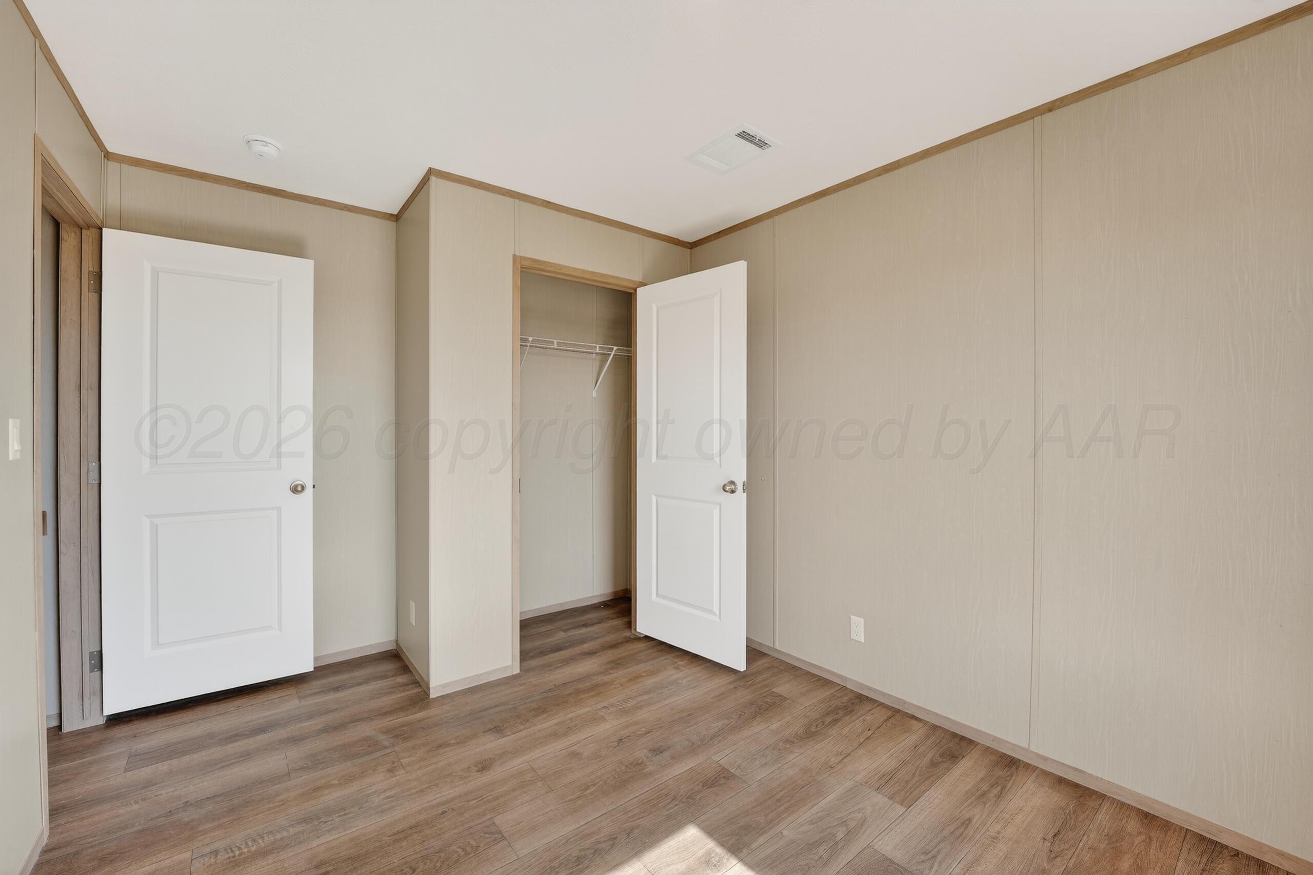 2680 Avery Rd Canyon Canyon, TX 79015 - Photo 25 of 37 a view of an empty room with wooden floor